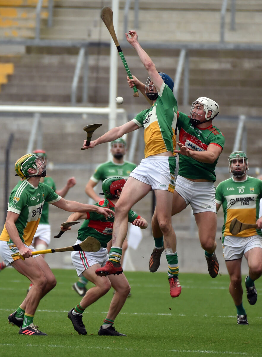 Fr. O'Neill's Sean O'Connor goes high with Bride Rovers' Michael Collins. Picture: Eddie O'Hare Fr. O'Neill's Sean O'Connor goes high with Bride Rovers' Michael Collins. Picture: Eddie O'Hare