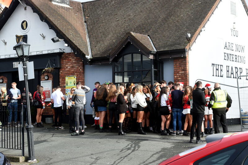Queues outside The Harp Bar, Ballyphehane, Cork at 1;30pm on Thursday. Picture: Larry Cummins. Queues outside The Harp Bar, Ballyphehane, Cork at 1;30pm on Thursday. Picture: Larry Cummins.