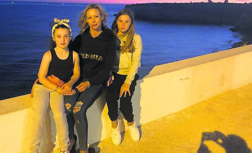 Elayne Ahern relaxing on holidays recently with her daughters Soraya and Giselle.