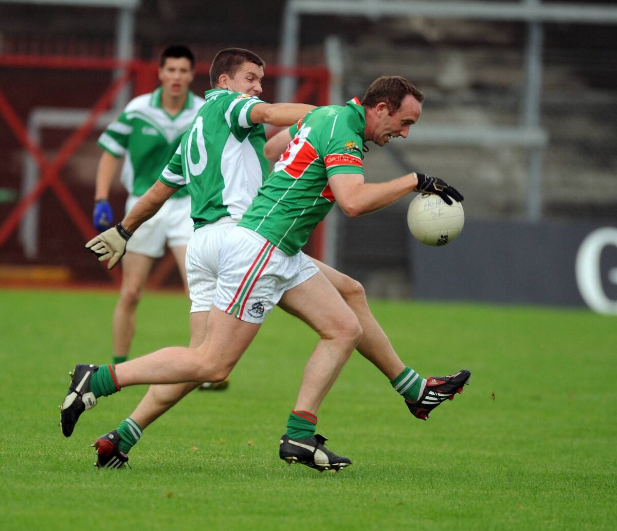 Clonakilty's Noel Griffin is tackled by Aghada's Dave Creedon during the Evening Echo Cork SFC at Páirc Uí Rinn. Picture: Eddie O'Hare
