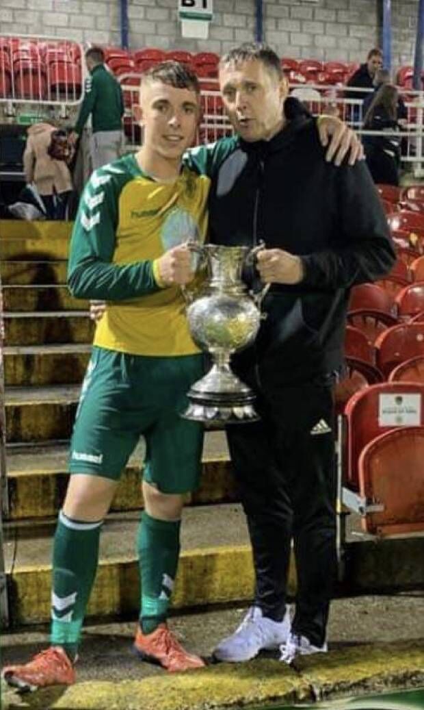Rockmount player Eóin Murphy with his father Ray at Turner's Cross after winning the Munster Senior Cup. Rockmount player Eóin Murphy with his father Ray at Turner's Cross after winning the Munster Senior Cup.