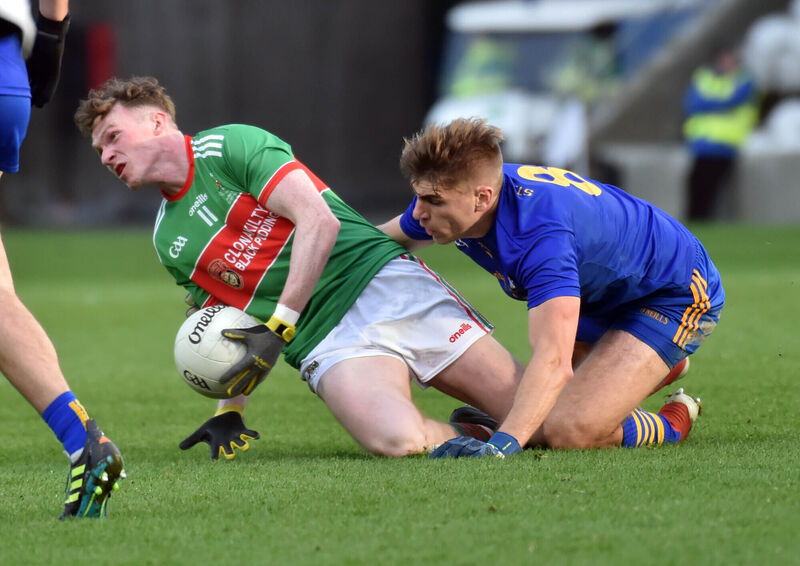 Clonakilty's Dara Ó Sé is tackled by St Finbarr's Ian Maguire. Picture: Eddie O'Hare