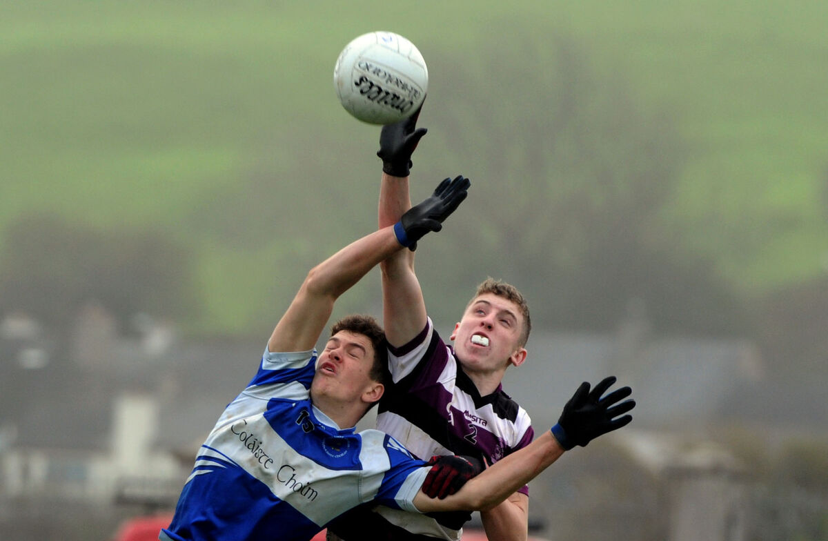 Shane Carey of Skibbereen Community School and Darragh O'Mahony of Coláiste Choilm, Ballincollig, going high for the ball. Picture Denis Minihane.