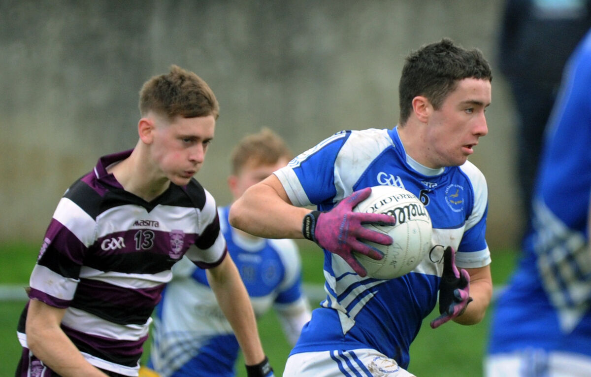 Conor Dodd, Coláiste Choilm, being chased by Fiachra Collins of Skibbereen. Picture Denis Minihane.