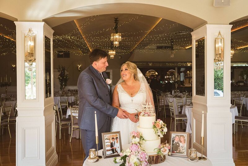 CAKE TRADITION: The couple cutting their beautiful cake by Daisy Chain Cakes, based in West Cork.