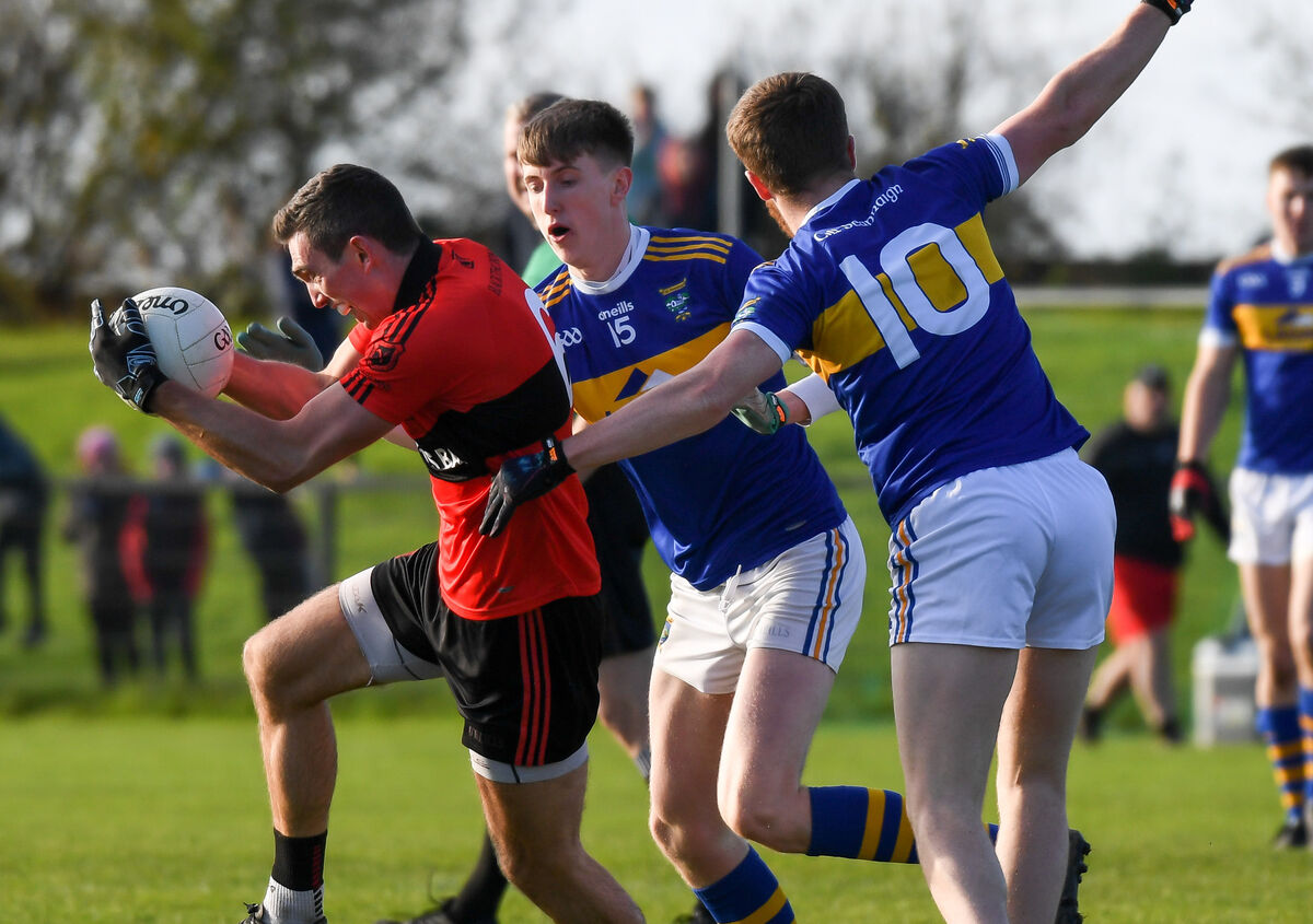  Mitchelstown centre-back Shane Beston drives out of defence past Kilshannig's Kieran Twomey and Tom Cunningham. Picture: David Keane.