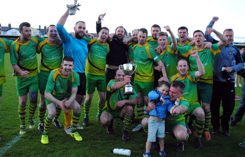 The Knockraha players celebrate after being presented with the County Cup following their 4-2 penalty shootout victory over Donoughmore after it was 1-1 over extra time back in 2018-19. Picture: Barry Peelo. The Knockraha players celebrate after being presented with the County Cup following their 4-2 penalty shootout victory over Donoughmore after it was 1-1 over extra time back in 2018-19. Picture: Barry Peelo.