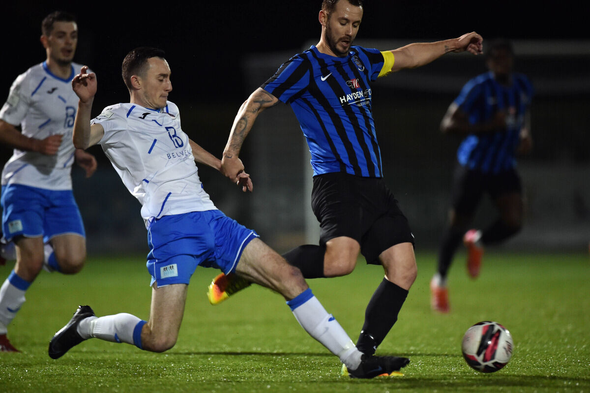 Lee Devitt, Cobh Ramblers in action against Kurtis Byrne, Athlone Town. Picture: Ray Ryan