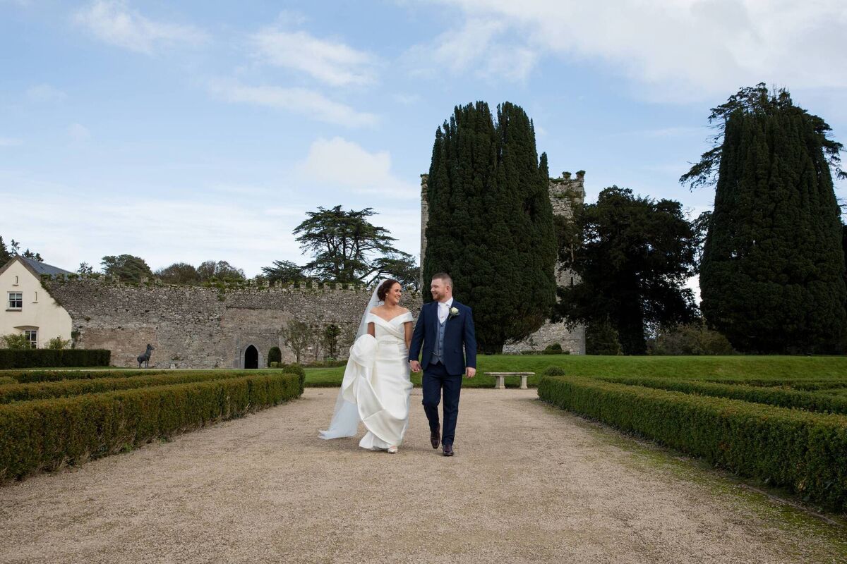 The couple strolling through Castlemartyr Resort. The staff there were fantastic and gave them the most special and memorable day. The couple strolling through Castlemartyr Resort. The staff there were fantastic and gave them the most special and memorable day.