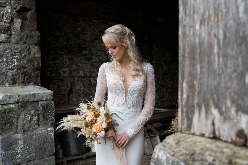 The bride wore a dress from Cinderella’s Closet. Hair was by Debbie (DKH hair salon), make-up was by Jessica O’Sullivan @portraitbyjessica.