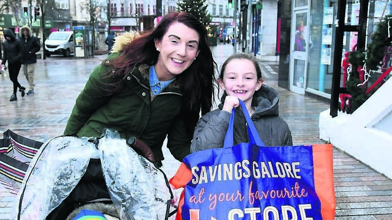 PICS: Cork city streets not packed, but customers out to buy