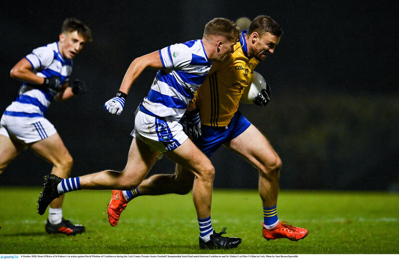 Denis O'Brien of St Finbarr's battles David Whelton of Castlehaven. Picture: Sam Barnes/Sportsfile