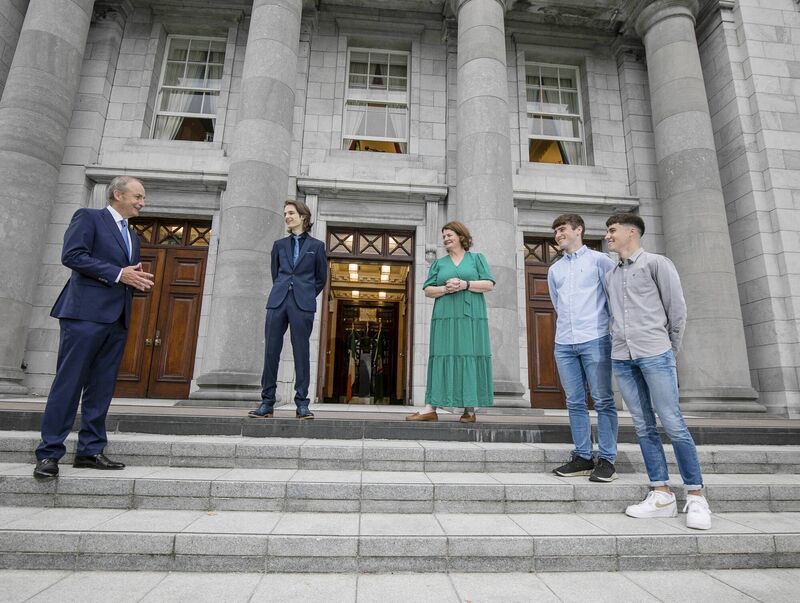 An Taoiseach Micheal Martin pictured with Head of the BT Young Scientist &amp; Technology Exhibition, Mari Cahalane (centre) alongside BTYSTE 2021 winner, Gregory Tarr from Cork, and BTYSTE 2020 winners, Cormac Harris and Alan O’Sullivan (right), also from Cork, at City Hall, Cork. Picture: Chris Bellew /Fennell Photography 2021