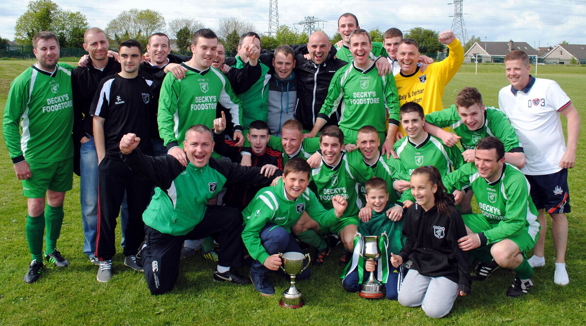 Glenthorn Celtic's manager Donal Cronin, players and supporters show off the League 1A and City Challenge Cup trophies won in 2013. Picture: Barry Peelo. Glenthorn Celtic's manager Donal Cronin, players and supporters show off the League 1A and City Challenge Cup trophies won in 2013. Picture: Barry Peelo.