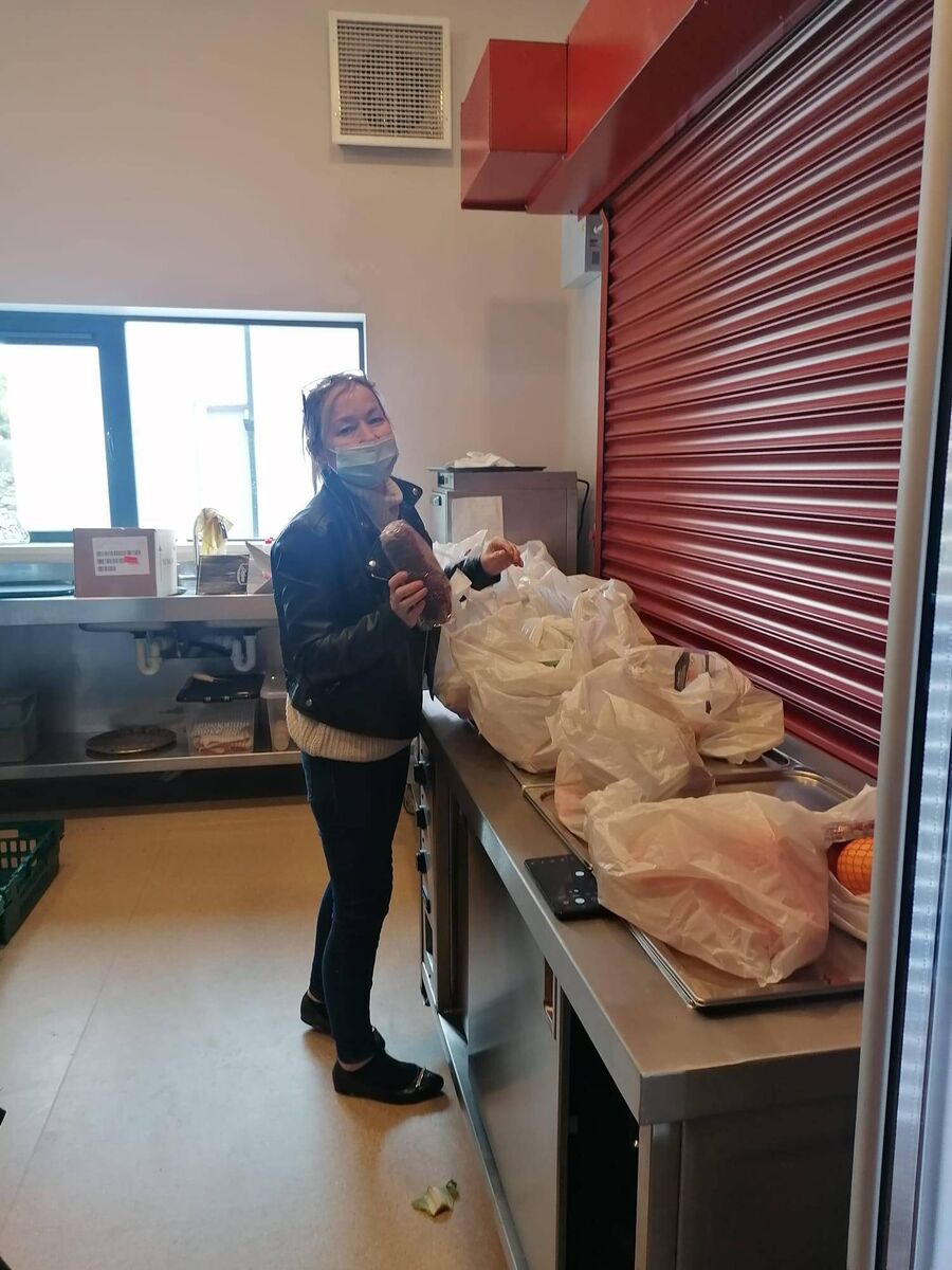 Feed Sandra McCormack, a West Cork volunteer.  The blackboard was set up to meet the growing needs of people struggling with the rising cost of living.