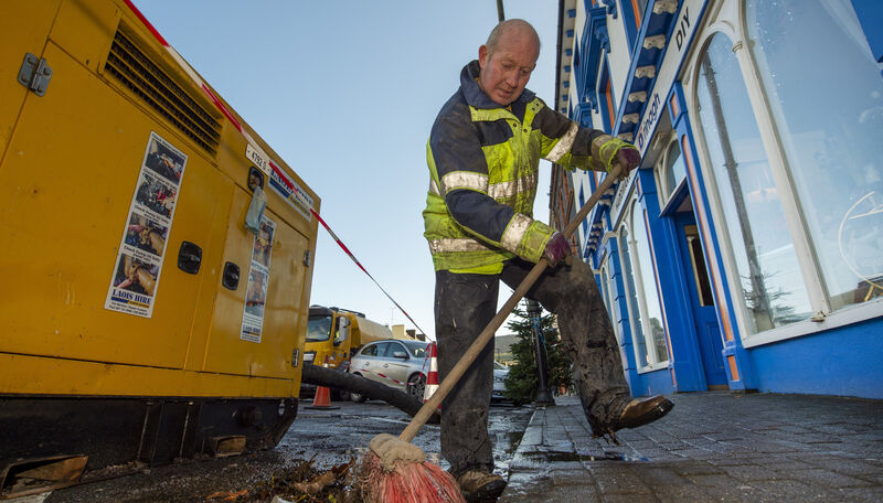  John Allen, Cork County Council brushing up the seaweed which was washed up through the drains during Storm Barra in Bantry.