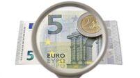 concept of creative accounting with magnifier and money