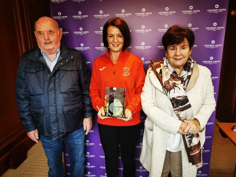 Olivia Keating receiving her Volunteer Cork award with her parents Tony and Rita.