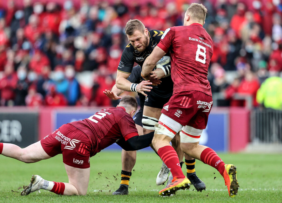 Wasps' Brad Shields is tackled by Diarmuid Barron and Gavin Coombes of Munster. Picture: INPHO/Dan Sheridan
