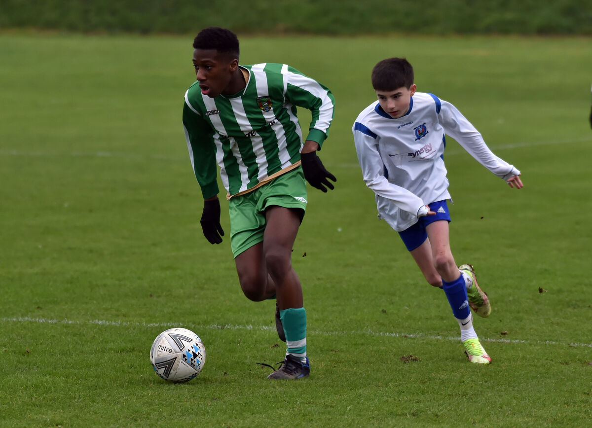 Passage's Rhema Mbakwe breaks from Leeds'  Evan Coughlan during the CSL U15 Division 1 tie. Picture: Eddie O'Hare