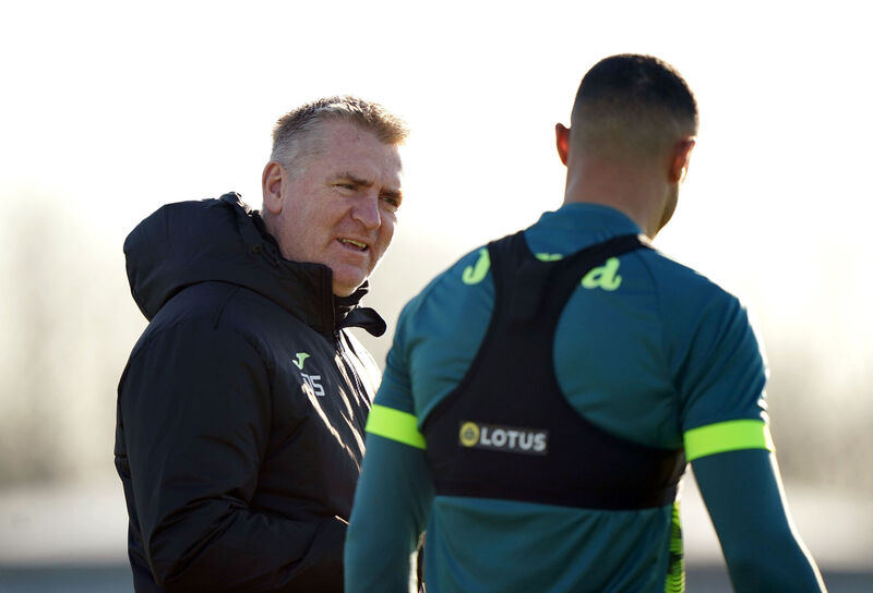 Norwich City manager Dean Smith speaks with Adam Idah during a training session at the Lotus Training Centre, Norwich. Picture: Joe Giddens/PA Wire. Norwich City manager Dean Smith speaks with Adam Idah during a training session at the Lotus Training Centre, Norwich. Picture: Joe Giddens/PA Wire.