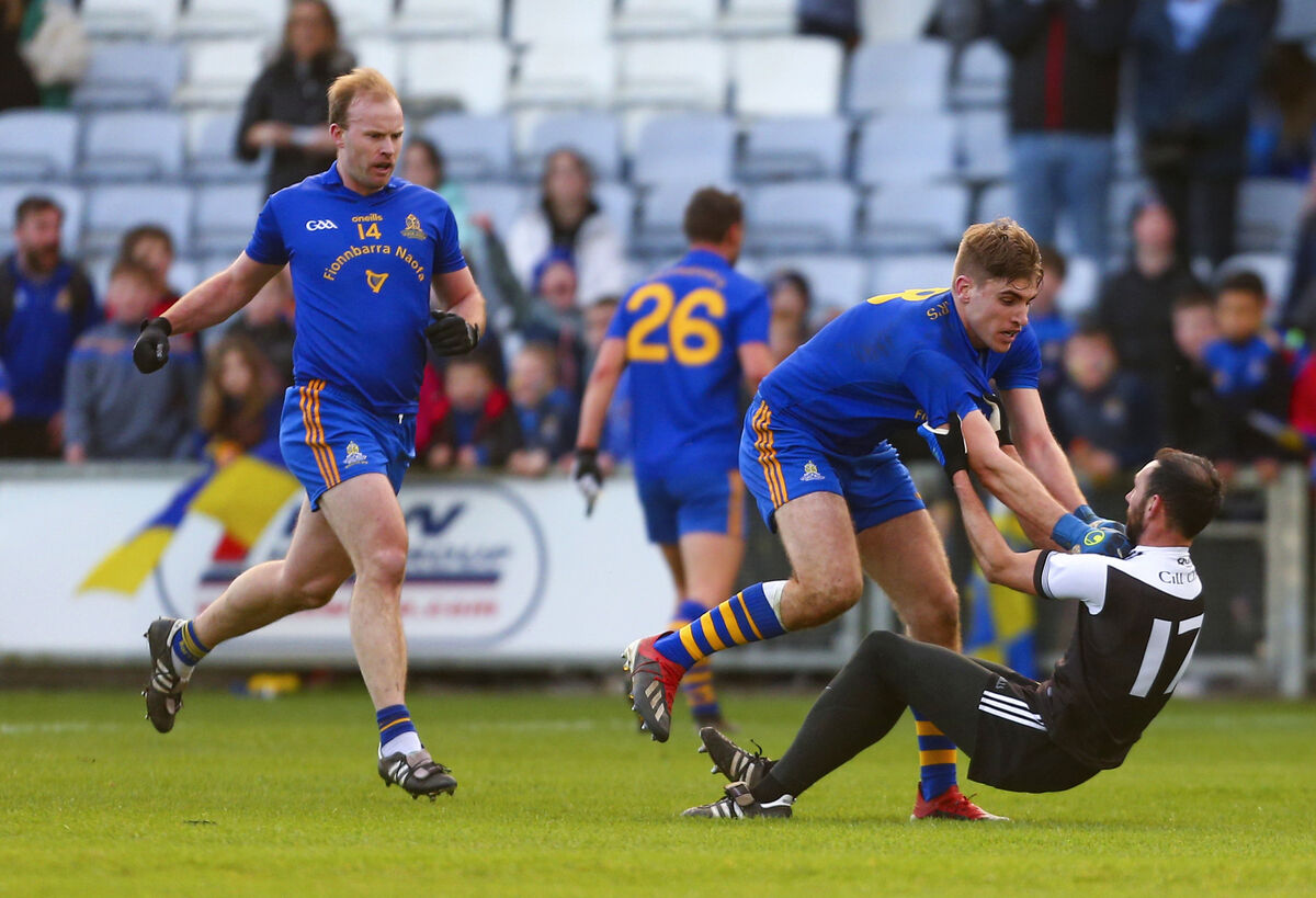 St Finbarr’s Ian Maguire and Kilcoo’s Aidan Branagan clash towards the end of the game. Picture: INPHO/Ken Sutton
