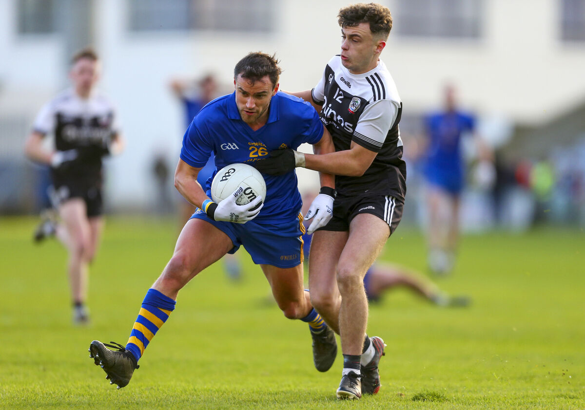 St Finbarr’s Enda Dennehy and Kilcoo’s Shealin Johnston. Picture: INPHO/Ken Sutton