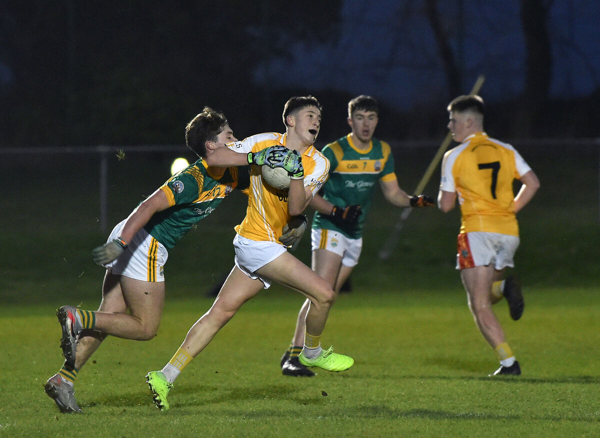  Luke Crowley, St Brendans Killarney, getting in a tackle on Olan Corcoran, Hamilton High School. Picture: Dan Linehan