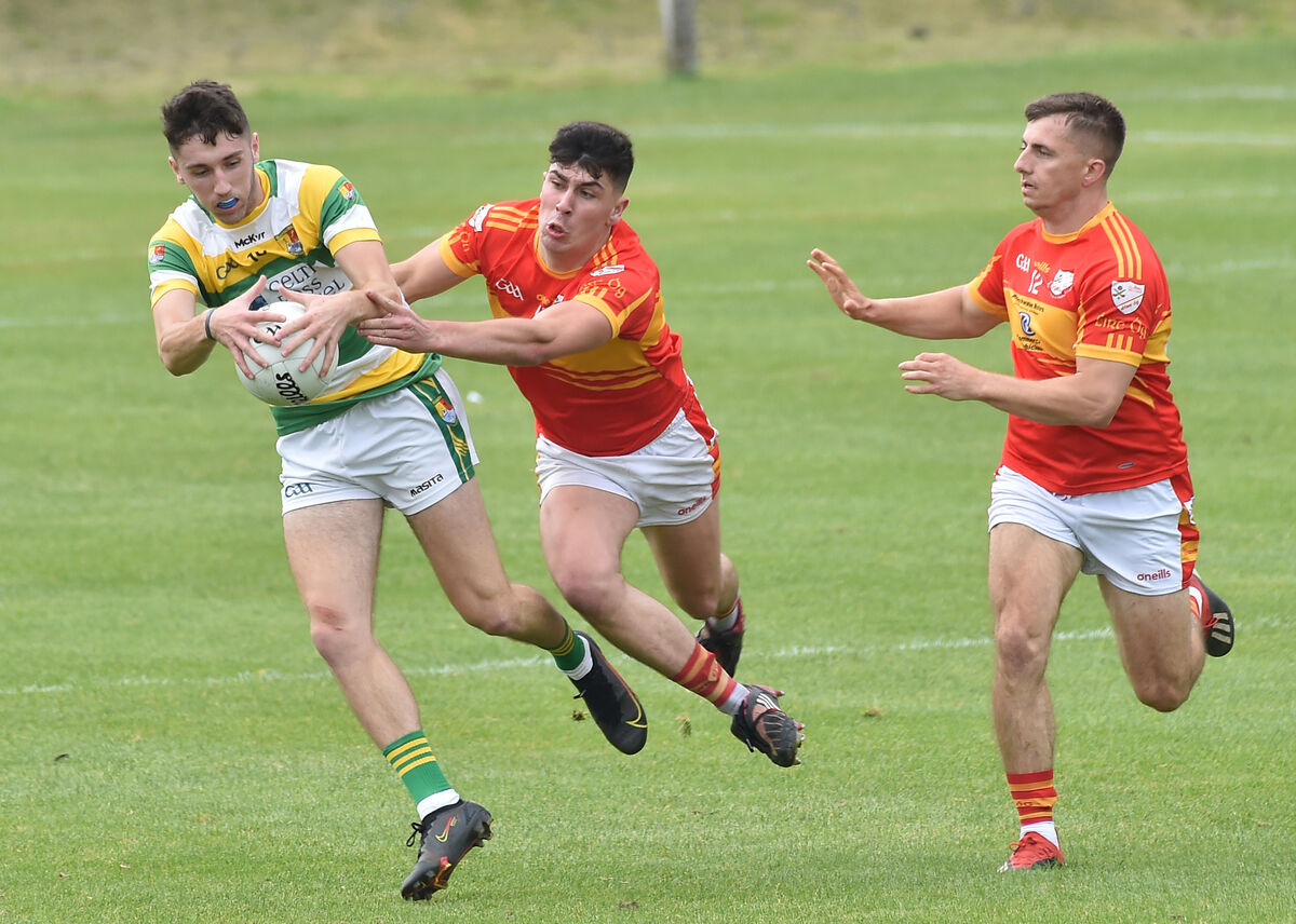 Jack O'Regan, Carbery Rangers, is tackled by Éire Óg players Dylan Foley and Kevin Hallisey, after making the step up to PSFC. Picture: Dan Linehan Jack O'Regan, Carbery Rangers, is tackled by Éire Óg players Dylan Foley and Kevin Hallisey, after making the step up to PSFC. Picture: Dan Linehan