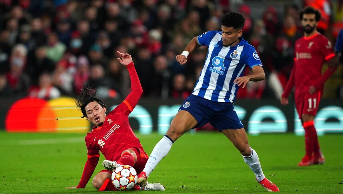 Liverpool's Takumi Minamino (left) and Porto's Luis Diaz battle for the ball during their Champions League match at Anfield, last November. They will now become teammates. 