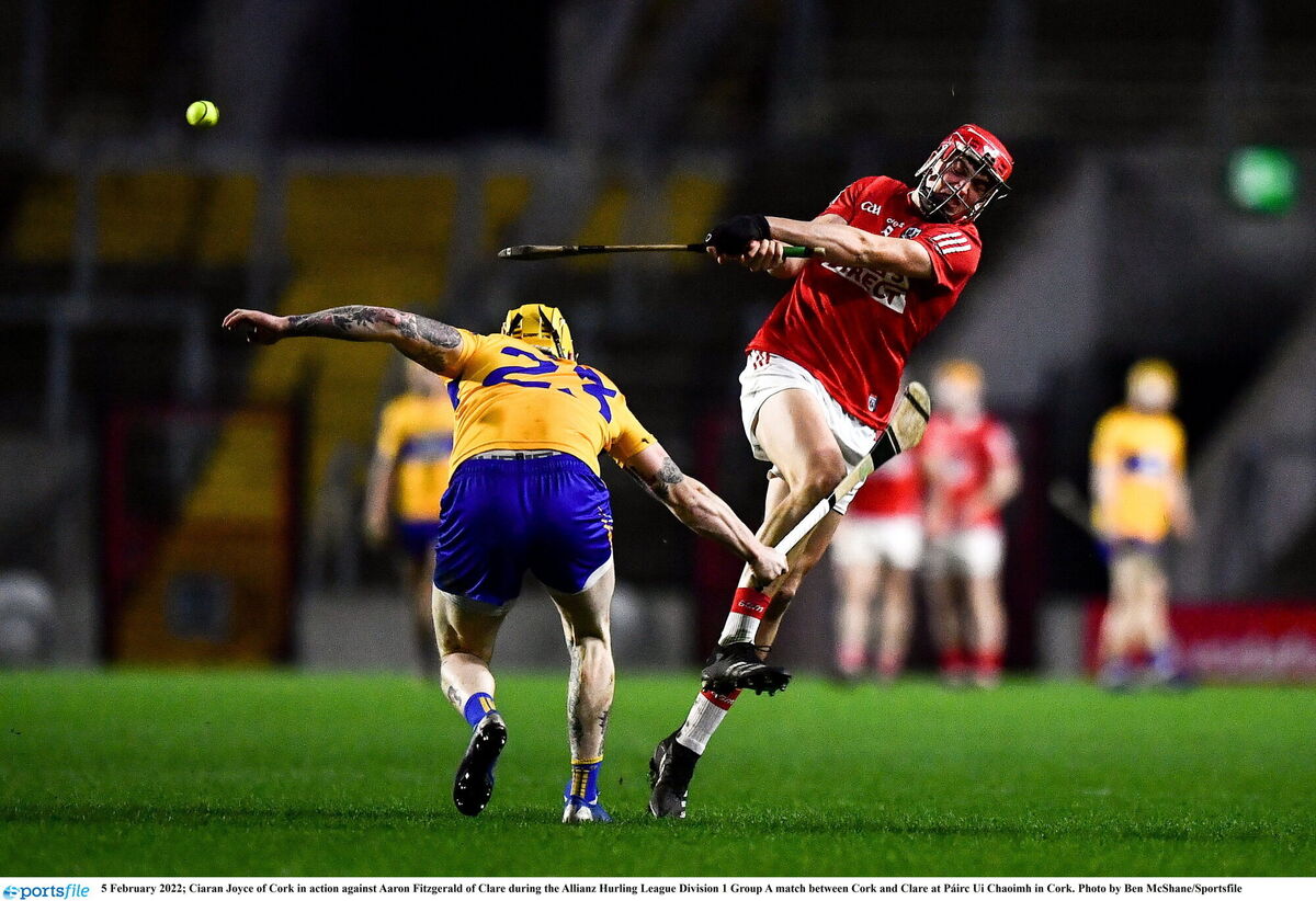Ciaran Joyce of Cork in action against Aaron Fitzgerald of Clare. Picture: Ben McShane/Sportsfile