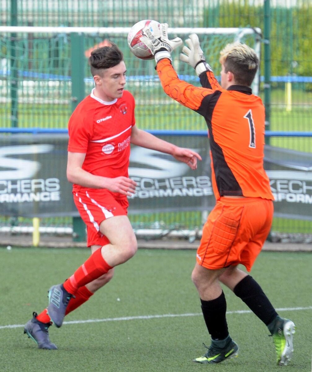 Galway League goalkeeper Kallum Fahy saves from Cork Youth Leagues' Ethon Varian. Picture: Denis Minihane. Galway League goalkeeper Kallum Fahy saves from Cork Youth Leagues' Ethon Varian. Picture: Denis Minihane.