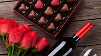 Valentines day with red roses, wine and chocolate