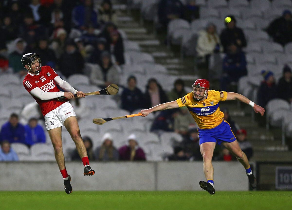Cork's Padraig Power shoots despite pressure from Clare's Paul Flanagan. Picture: INPHO/Ken Sutton