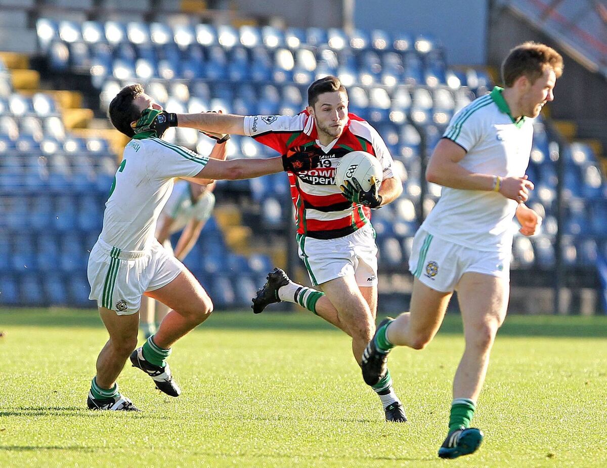 Ryan Hogan, Ballincollig, taking on Jake O'Donoghue, Aghada, at Páirc Uí Rinn. Picture. Jim Coughlan
