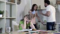 Upset child listening divorcing parents fight, suffering from conflict in family