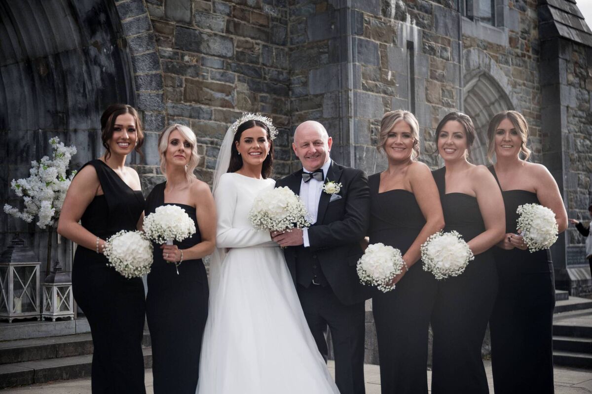 The bride with her father and her bridal party. The bride with her father and her bridal party.