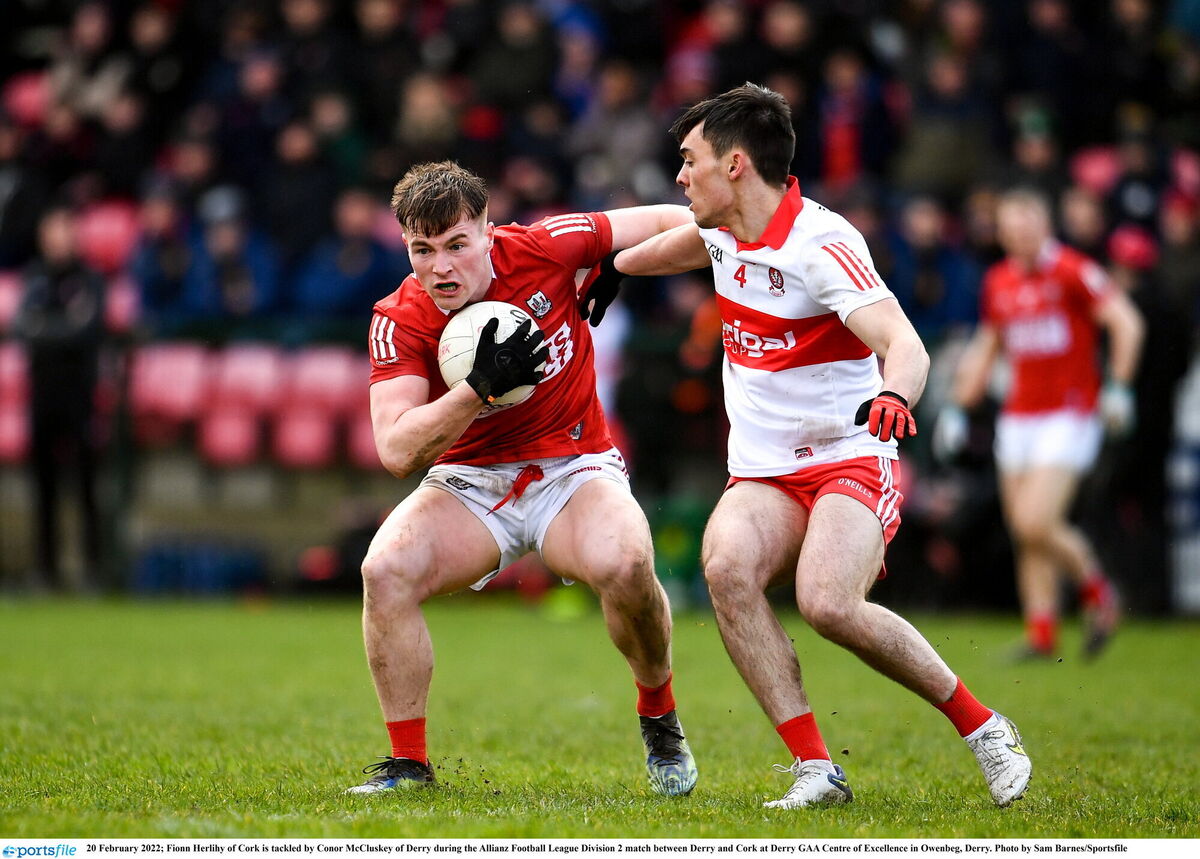 Fionn Herlihy of Cork is tackled by Conor McCluskey of Derry during the Allianz Football League Division 2 match at Derry GAA Centre of Excellence in Owenbeg. Picture: Sam Barnes/Sportsfile