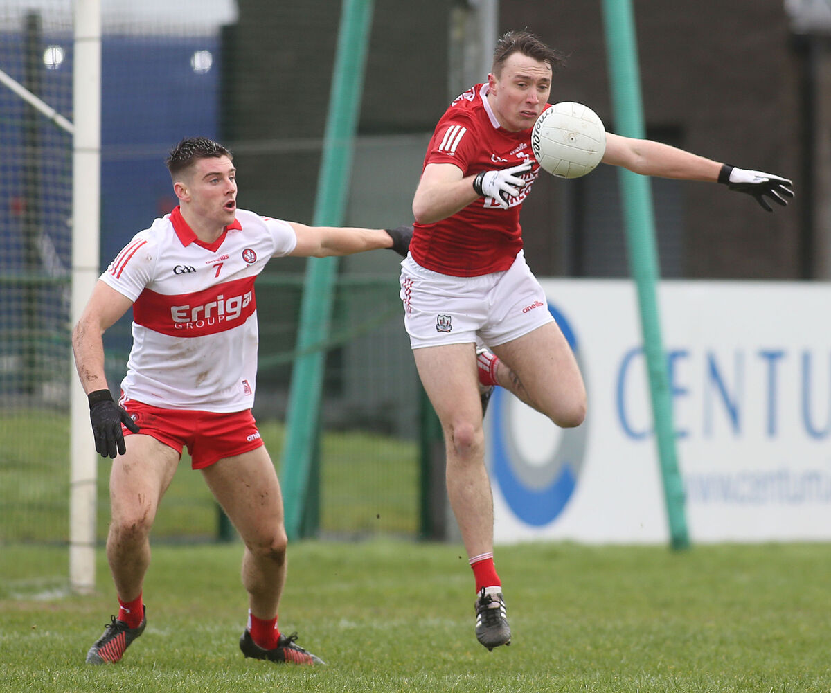 Cork’s Sean Meehan and Derry's Conor Doherty battle for possession. Picture: INPHO/Lorcan Doherty
