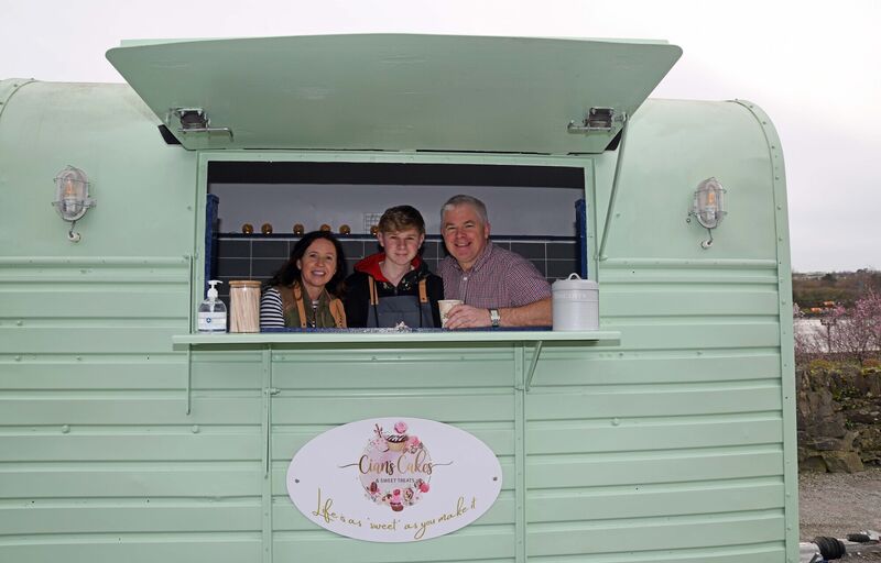 Cian Foley in his catering trailer at Glounthaune with his parents Olivia and Darren.