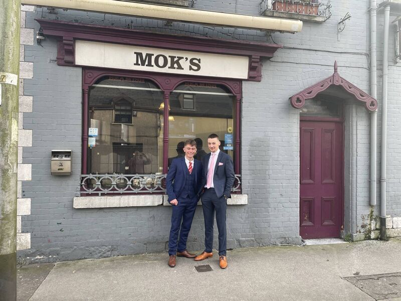 Jack Ellis and outside his father’s bar with Mark Callanan, at Moks on Bandon Road, the family bar, where he works from time to time.