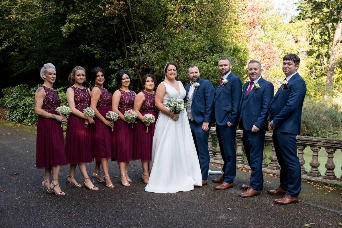 The bride and groom with their wedding party. The bride and groom with their wedding party.