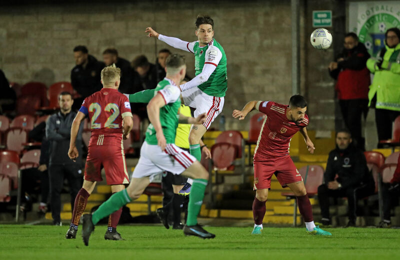  Ruairi Keating, Cork City, heads past Diego Portilla, Galway United. Picture: Jim Coughlan.