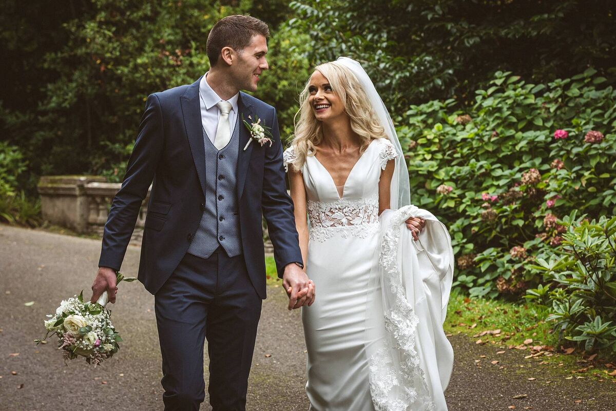 The newly weds hand in hand. The newly weds hand in hand.