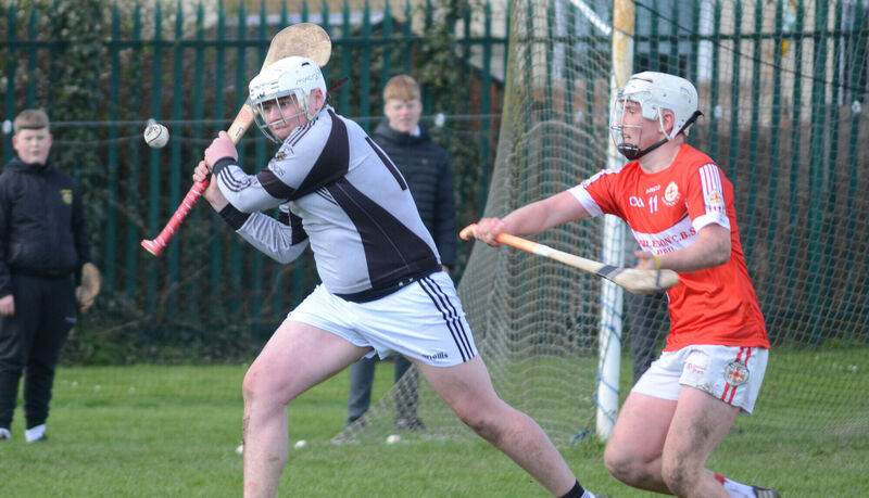 Rochestown keeper Sean Daly clears the ball upfield despite the attention from Midleton CBS's James O'Brien. Picture: Howard Crowdy Rochestown keeper Sean Daly clears the ball upfield despite the attention from Midleton CBS's James O'Brien. Picture: Howard Crowdy