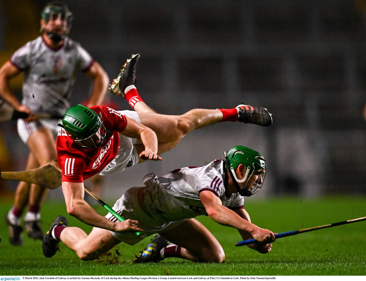Jack Grealish of Galway is tackled by Seamus Harnedy of Cork. Picture: Eóin Noonan/Sportsfile