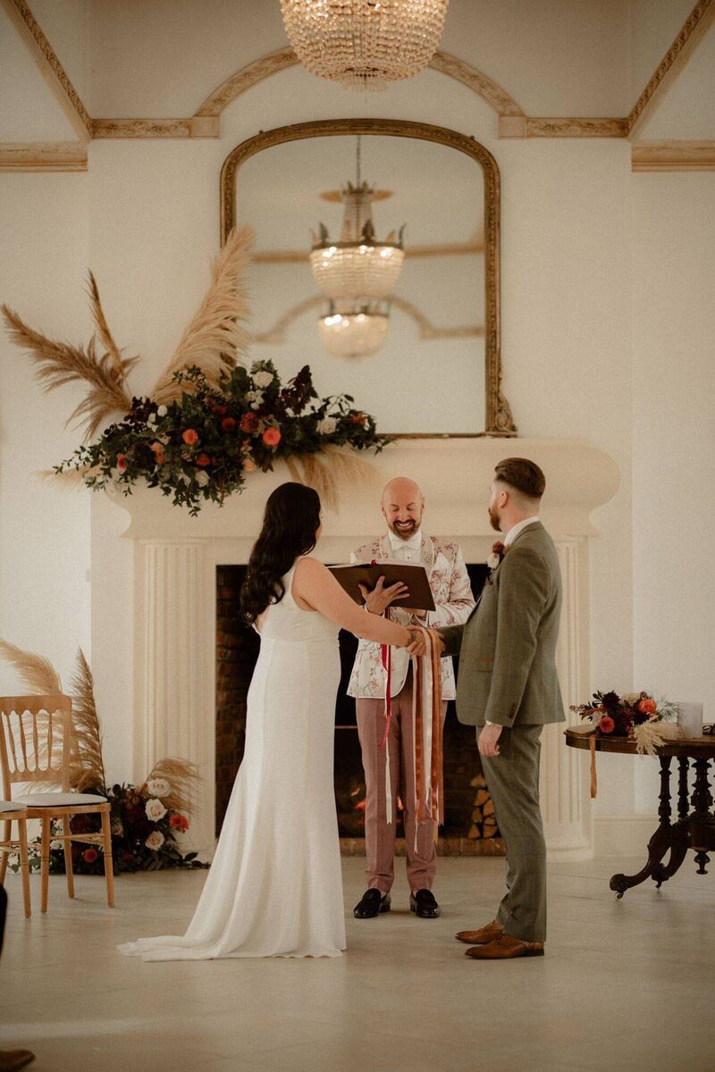 Stewart O'Sullivan, the UK's Celebrant of the Year, presiding over a wedding ceremony.