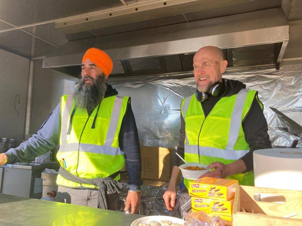 Balwant Singh, from Seattle, and Rob Anker, from Manchester, of Sikhs United, serving food to Ukrainian refugees at the Medyka border crossing in Poland. Picture: Donal O'Keeffe Balwant Singh, from Seattle, and Rob Anker, from Manchester, of Sikhs United, serving food to Ukrainian refugees at the Medyka border crossing in Poland. Picture: Donal O'Keeffe