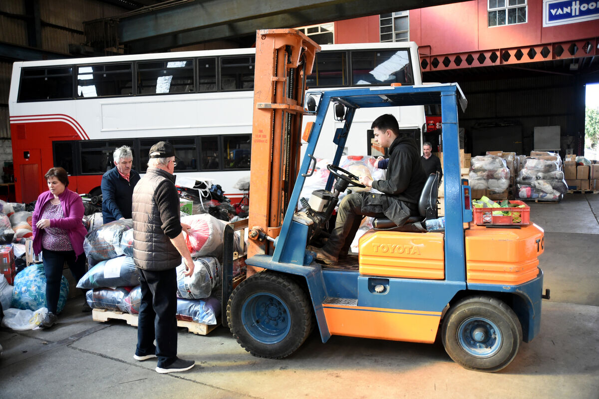  #SafeHarbourForUkraine volunteers packing items at Cronin's Coaches, Mallow Road, Cork for delivery in the aid convoy leaving on Tuesday. Pic: Larry Cummins