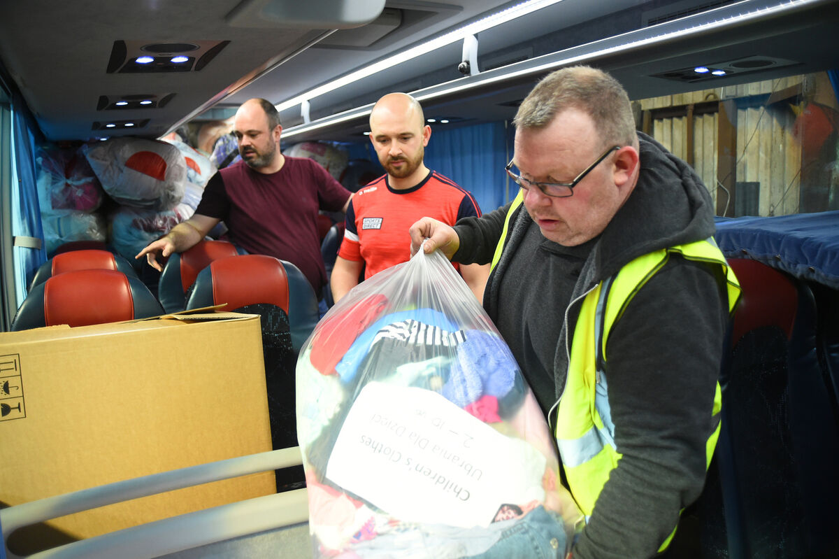  (front) Alan Lynch with bedding and towels being loaded onto the bus coach.Pic: Larry Cummins